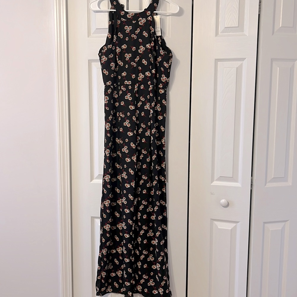 NWT black jumpsuit with white and red daisies